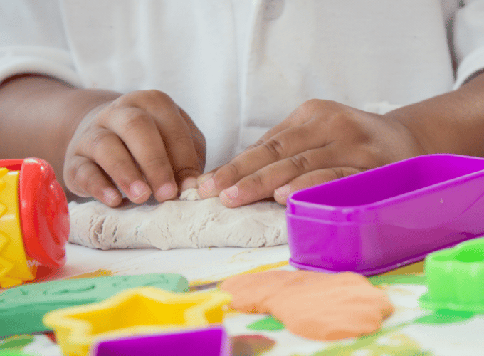 Child playing with play dough