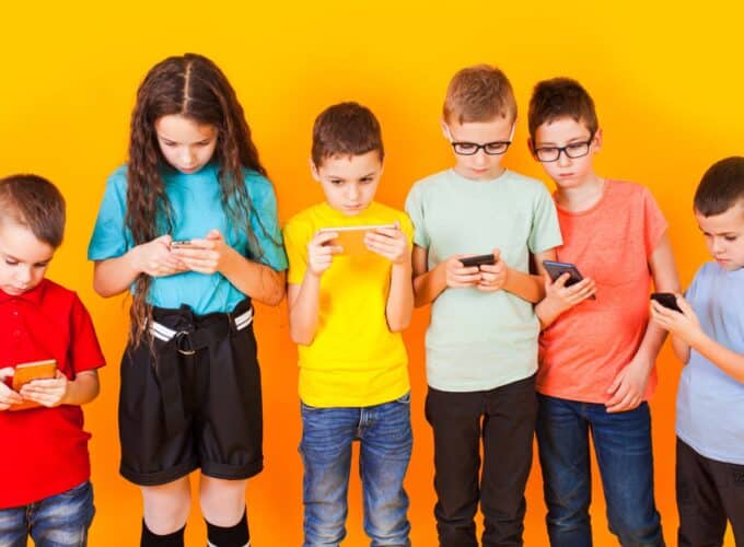 Children looking at phones