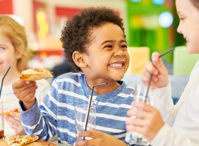 Children with drinks smiling