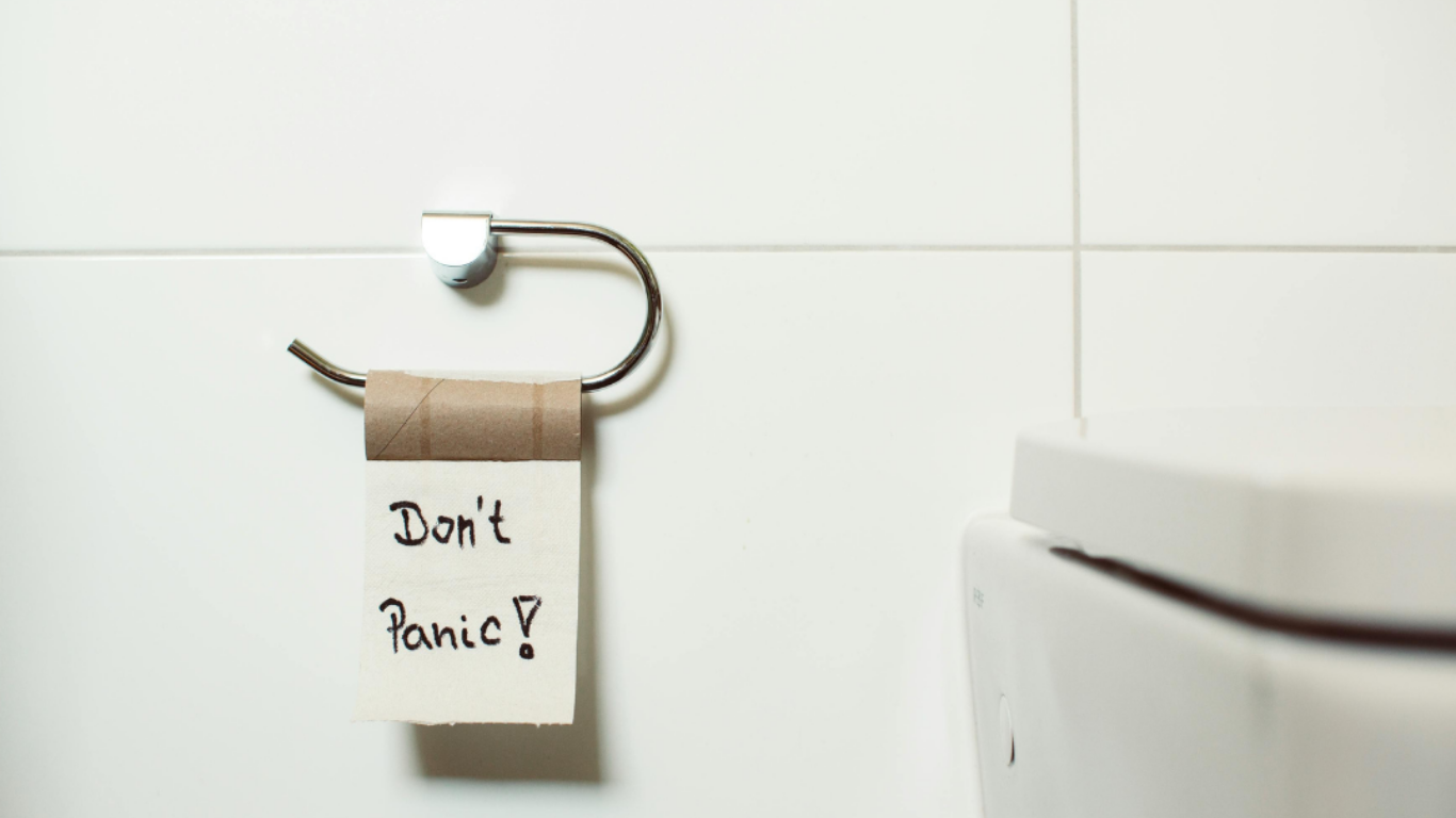 An empty toilet role with one sheet left saying 'Don't panic!'